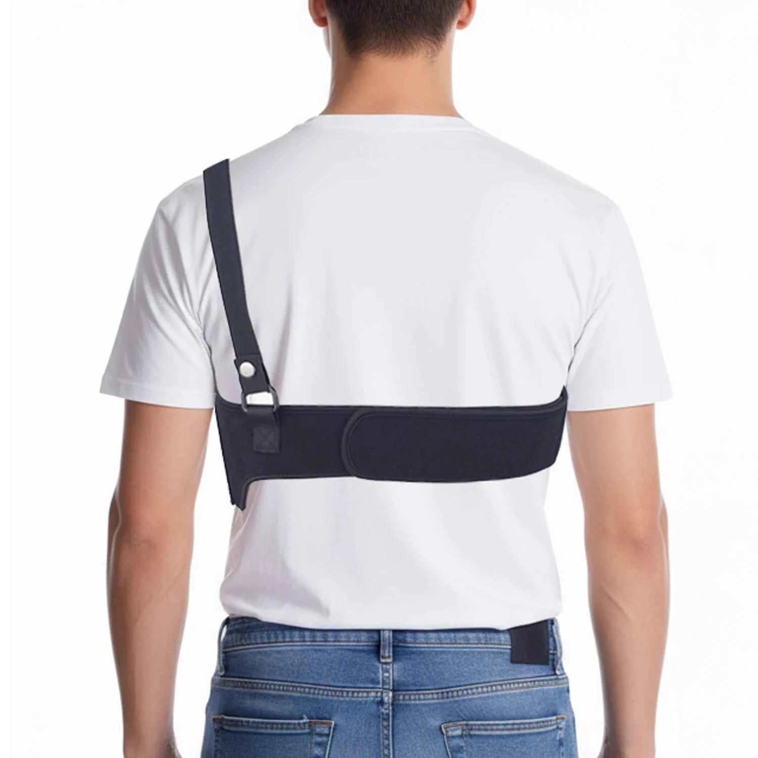 Person wearing a neoprene shoulder concealed underarm holster with a cross-body strap over a white T-shirt.